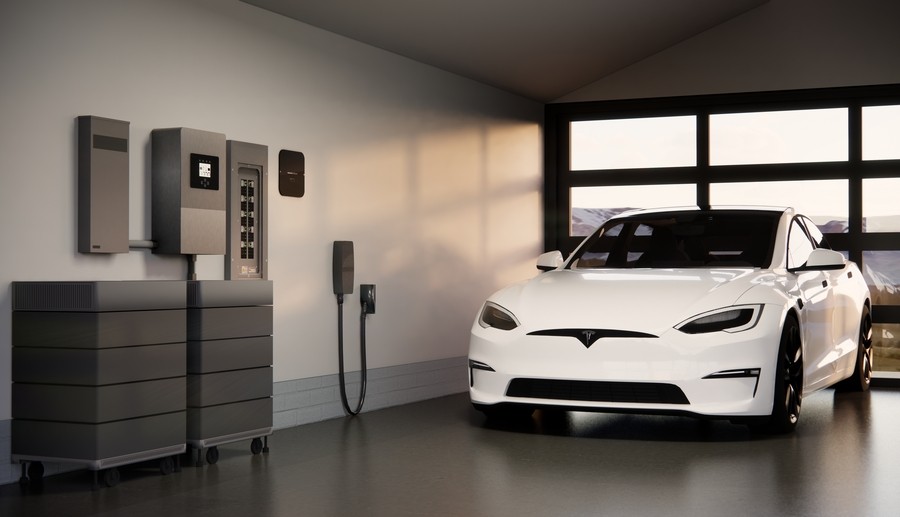 An electric vehicle plugged in next to a Savant-enabled electrical panel. 